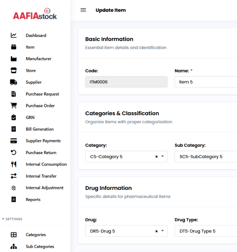 Two people sitting at a table looking at a laptop.